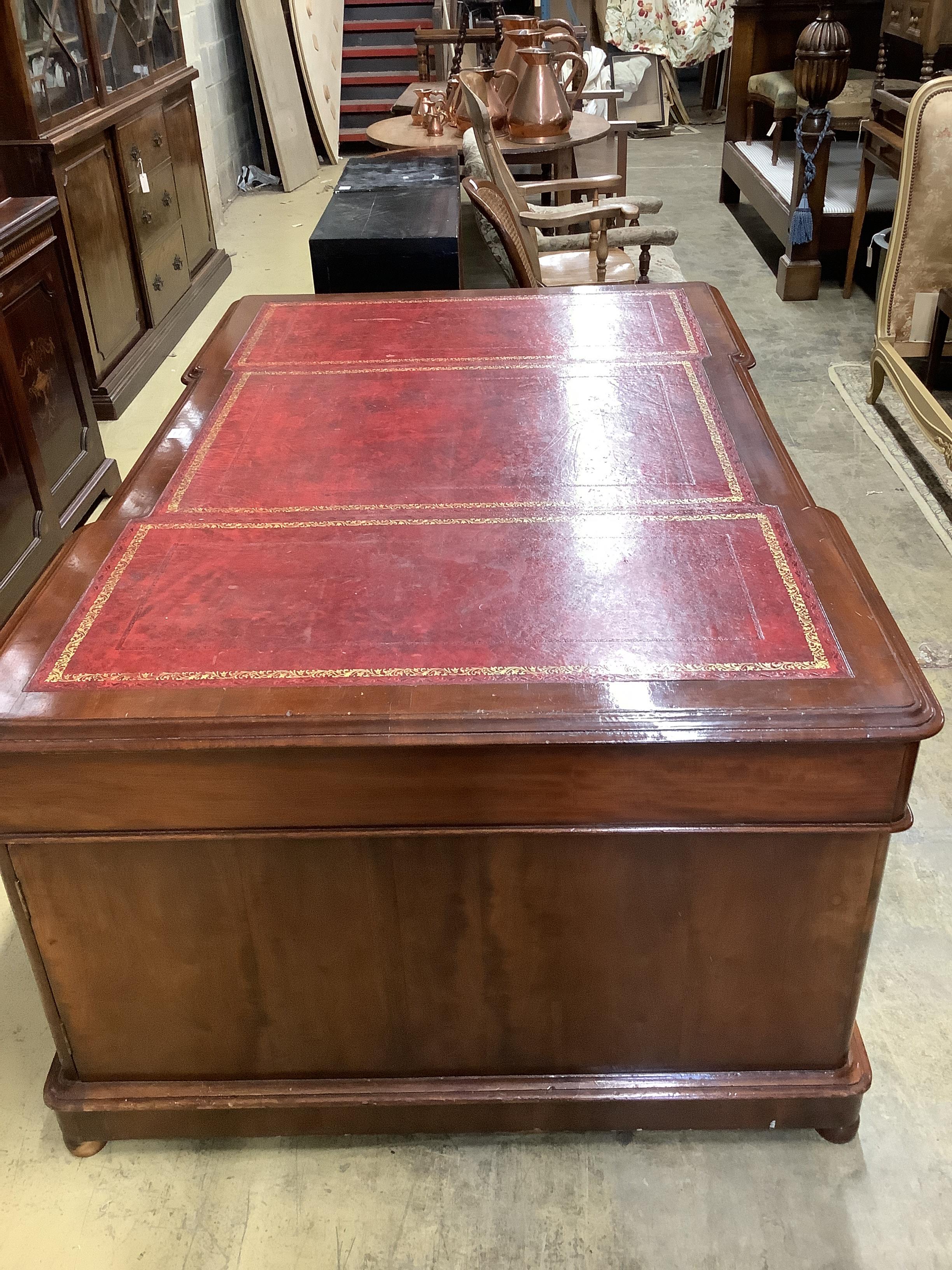 An early 20th century mahogany pedestal partner's desk, width 180cm, depth 116cm, height 78cm